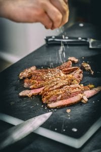 Cook seasoning roasted pork steak